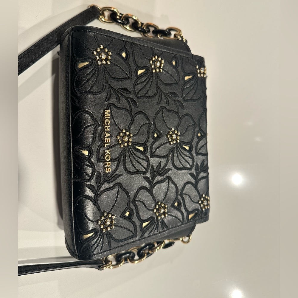 Michael kors Black sling bag .